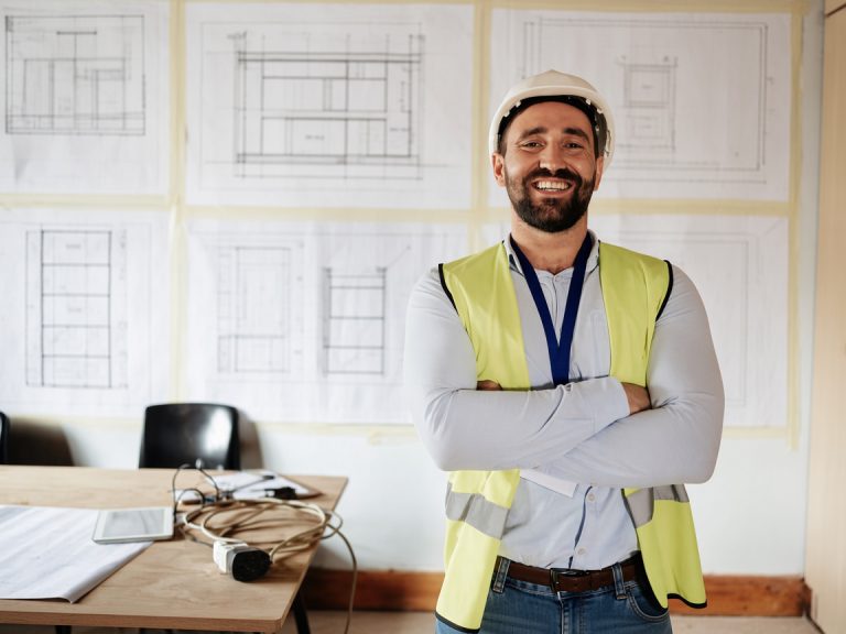 Engineer, technician or construction worker happy at work after completing a construction business growth training course