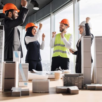 Positively fired-up and happy construction team